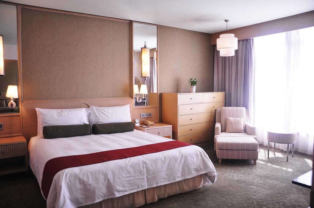 Hotel Nikko Tianjin Exterior foto A bedroom at the hotel